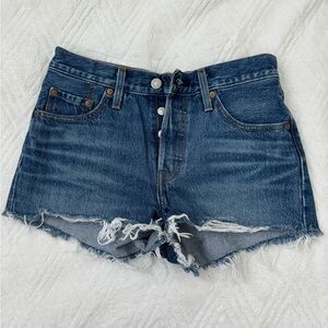 Women’s mid-rise dark wash denim shorts with raw hem